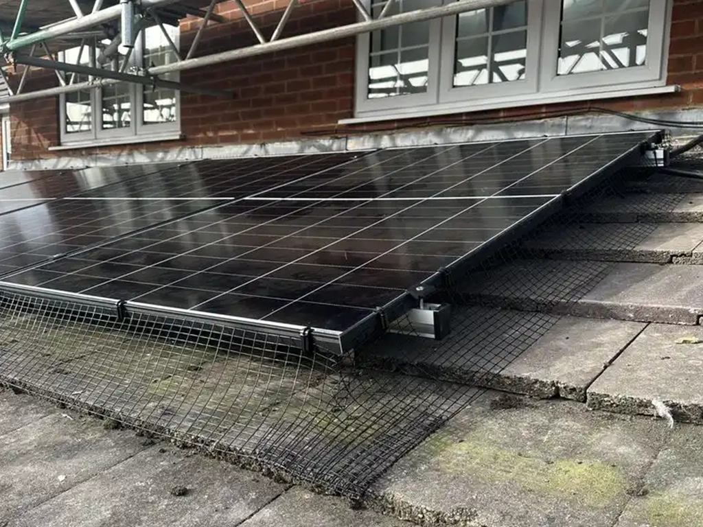 Solar panels being installed on a residential tiled roof
