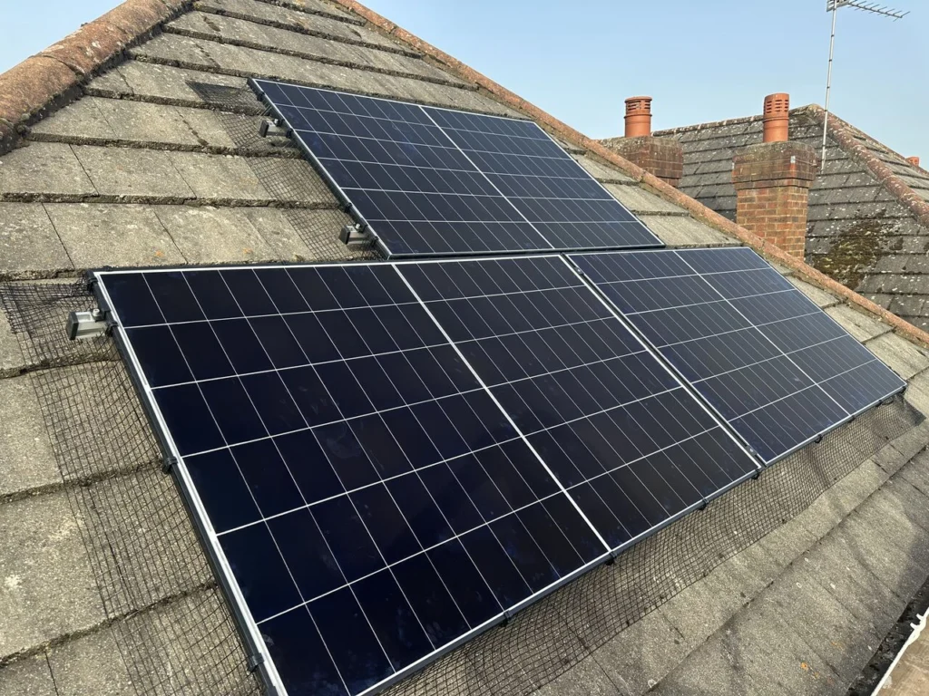 •	Solar panels on a residential slate roof - professional solar PV installation